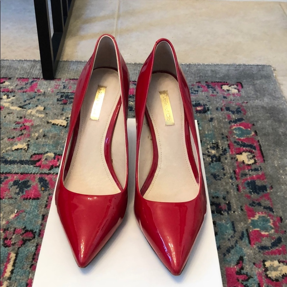 Red patent leather pumps